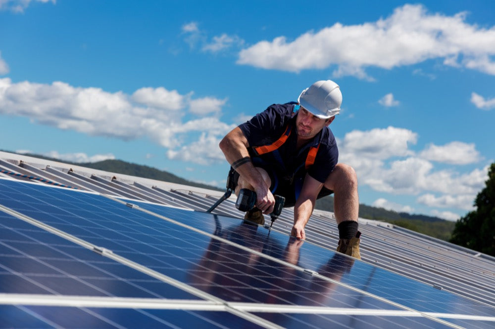 Electrician installing solar panels